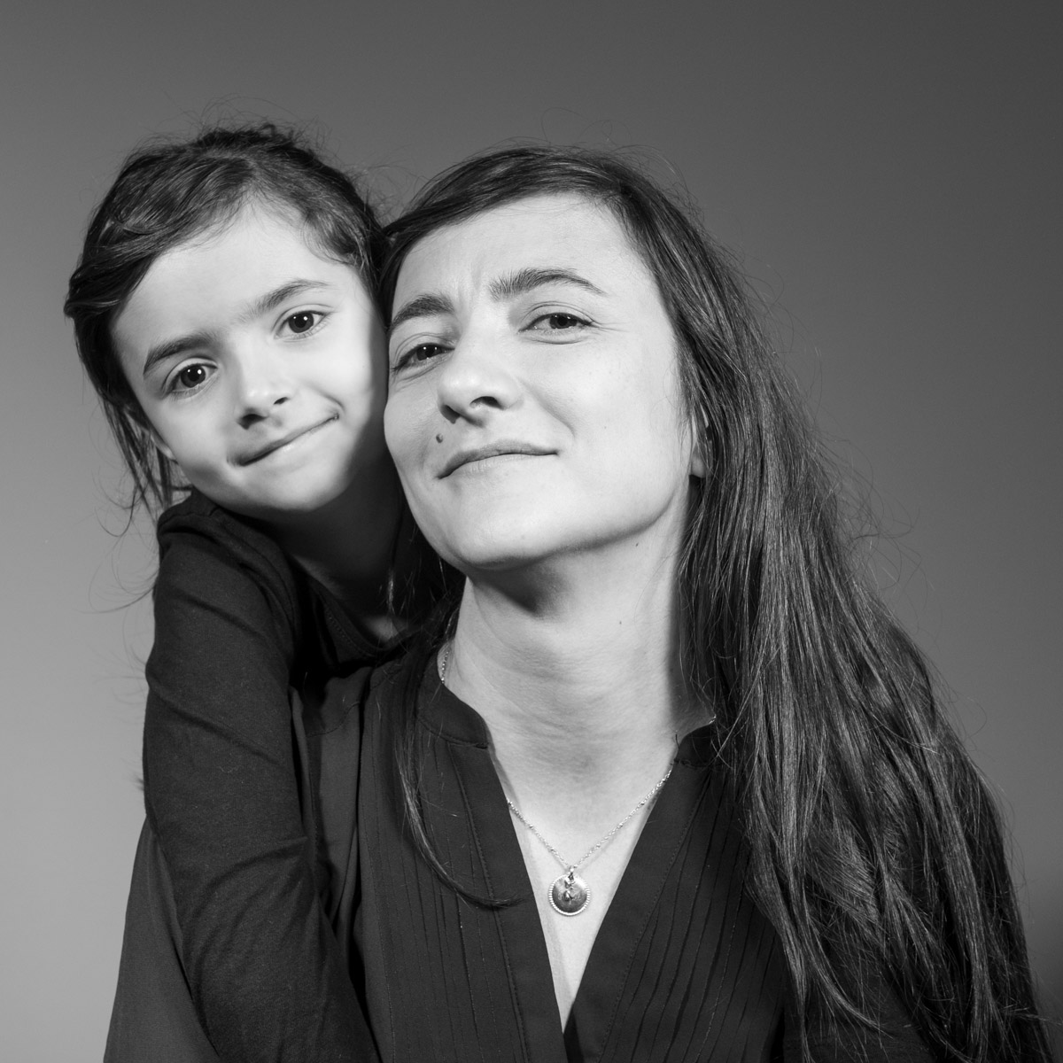 Mother and daughter family studio portrait in Lisbon