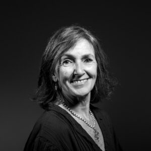 A smiling black-and-white studio portrait, Lisbon
